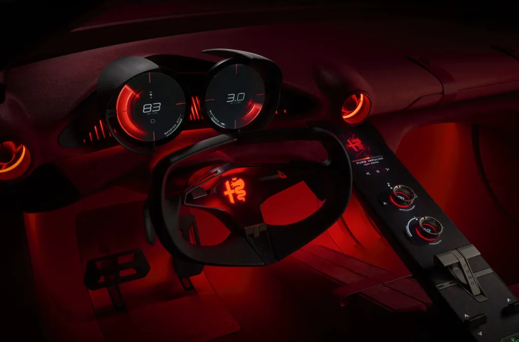Puesto de conducción del Alfa Romeo Cuorerosso: volante de tres radios y cuadro con dos elementos circulares