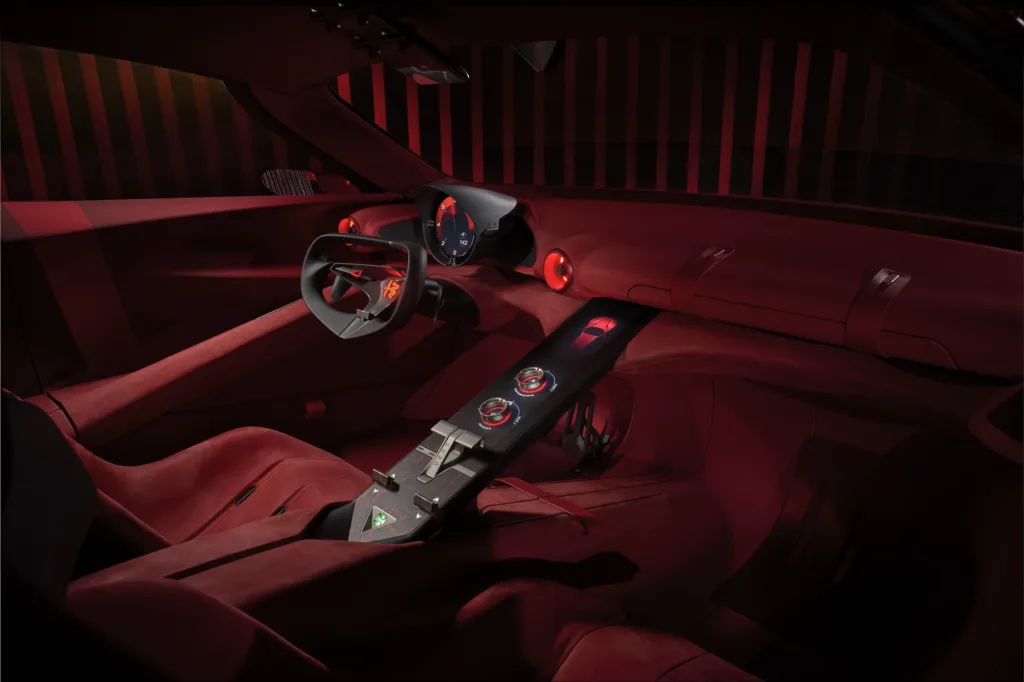 Interior del Alfa Romeo Cuorerosso: tapizado rojo, consola central alargada y volante de tres radios