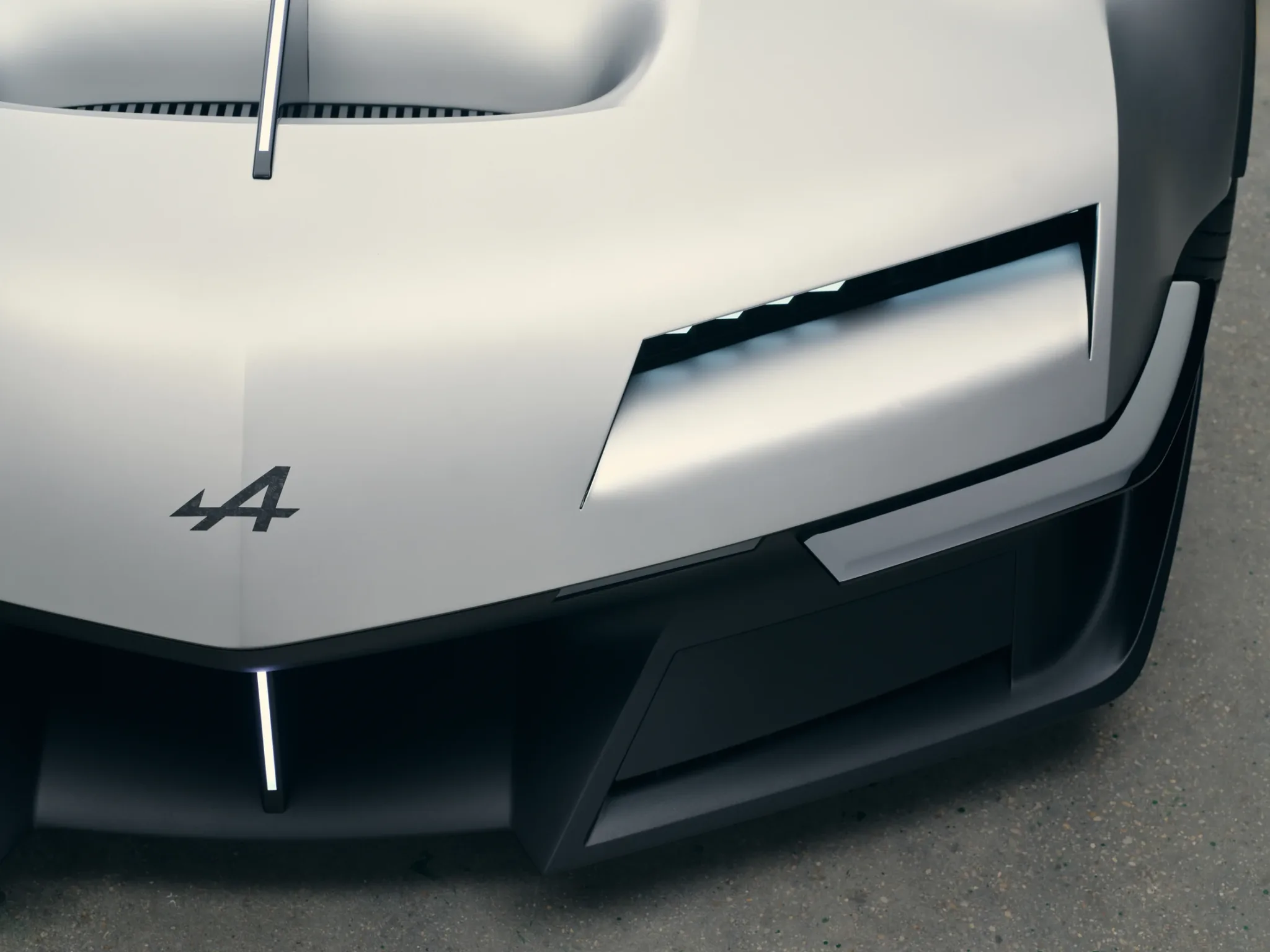 Detalle de los faros frontales del Alpine A310 Vision y del logotipo de la A flechada de Alpine