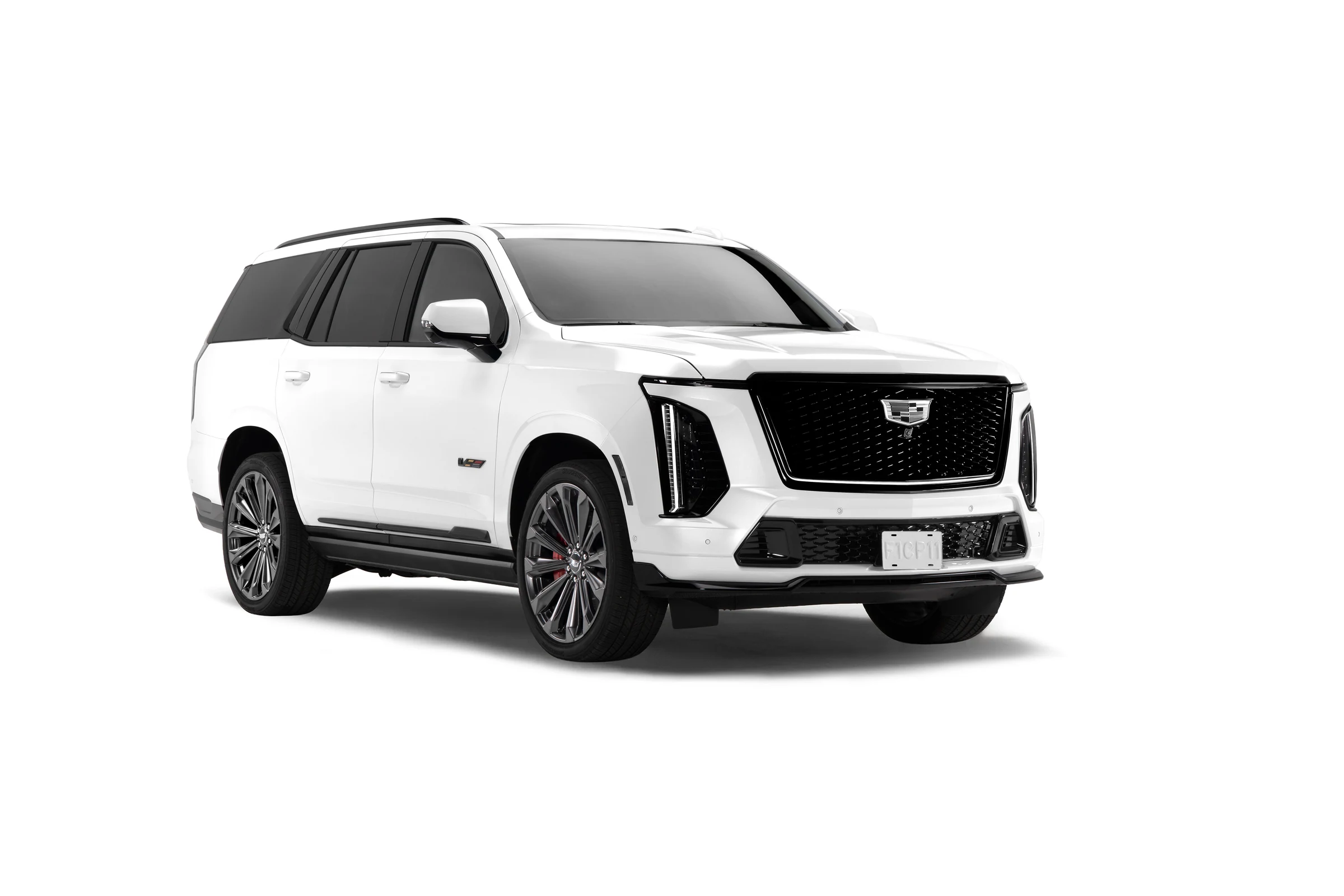 Frente de la Cadillac Escalade-V Edición Checo Pérez blanca, con la parrilla iluminada y logotipo monocromático