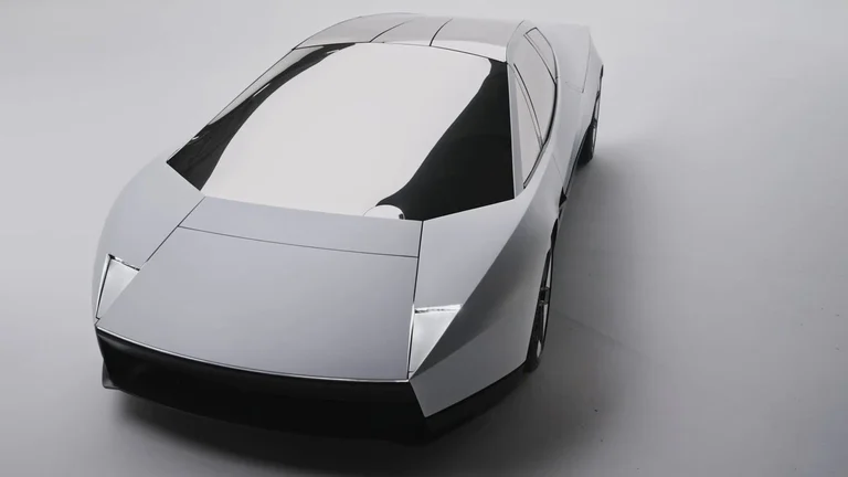 Nuevo Tesla Roadster blanco visto desde arriba y de frente, con carrocería angular y faros ocultos