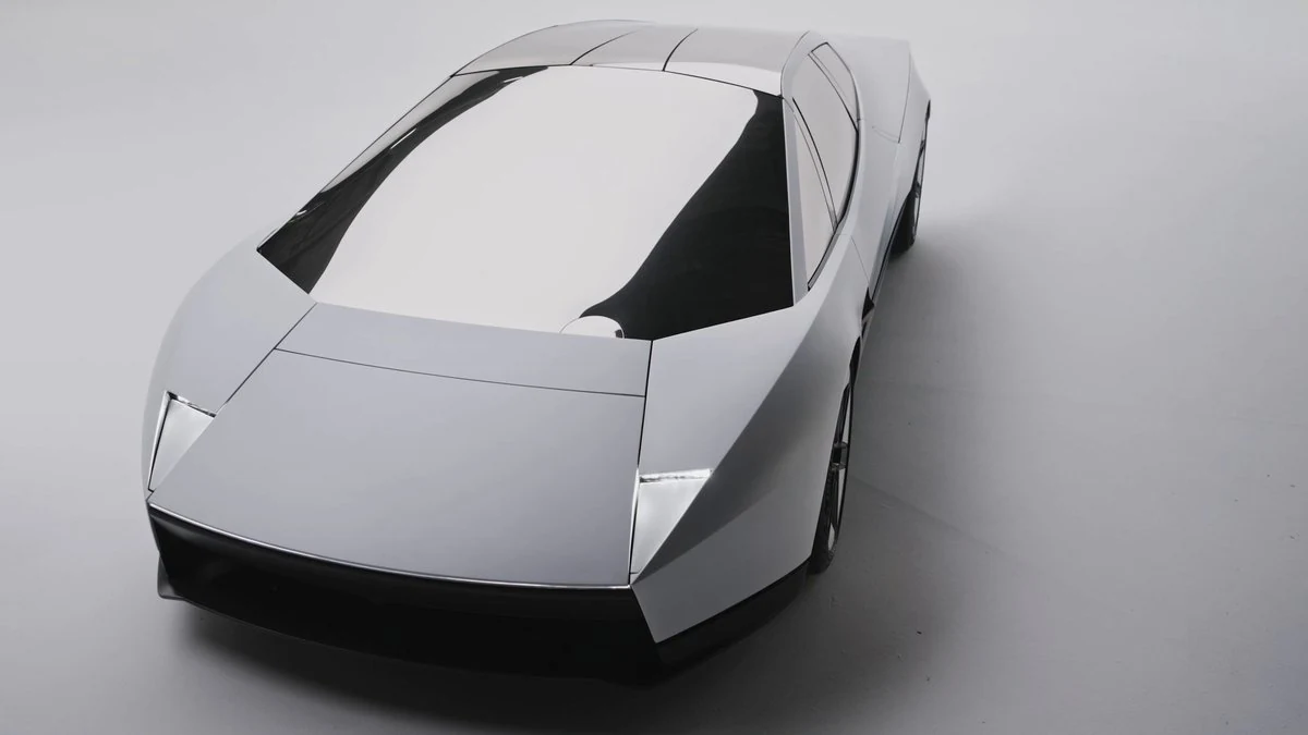 Nuevo Tesla Roadster blanco visto desde arriba y de frente, con carrocería angular y faros ocultos